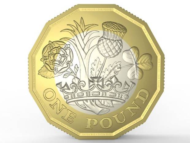 The new pound coin designed by 15 year old David Pearce
